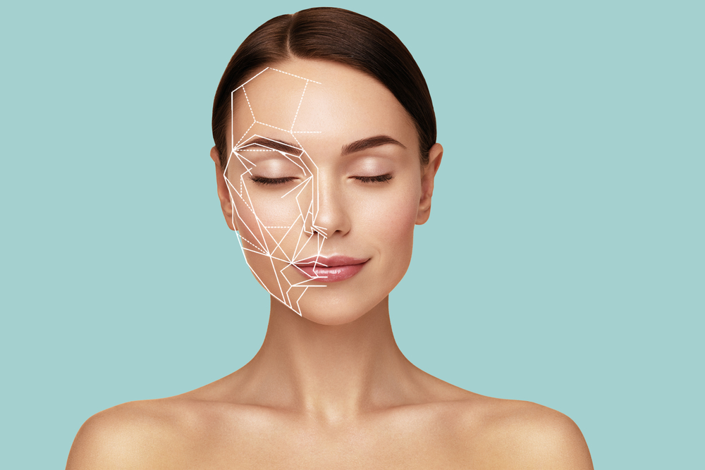 A woman with facial mapping, representing areas for dermal fillers to enhance facial symmetry and beauty.