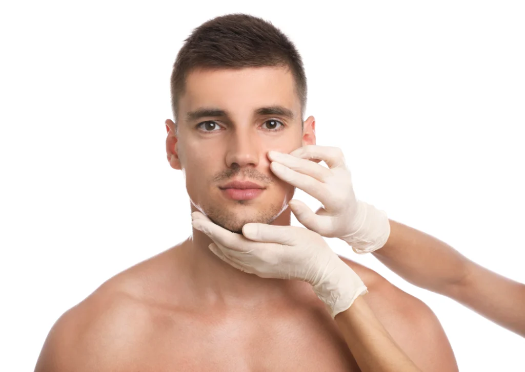 A smiling man after receiving rejuvenating acne treatments for men.